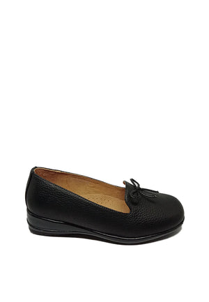 Embracing Elegance: A Tribute to Black Slip-On Shoes